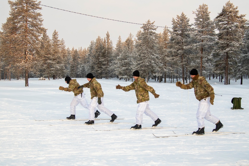 Charlie Troop, 3-71 Cavalry Regiment, 1BCT, 10th Mountain Division train with Finnish soldiers on a ski obstacle course during Defense Exercise North in Sodankyla Garrison, Finland, during Exercise Arctic Forge '23 on Feb. 21, 2023