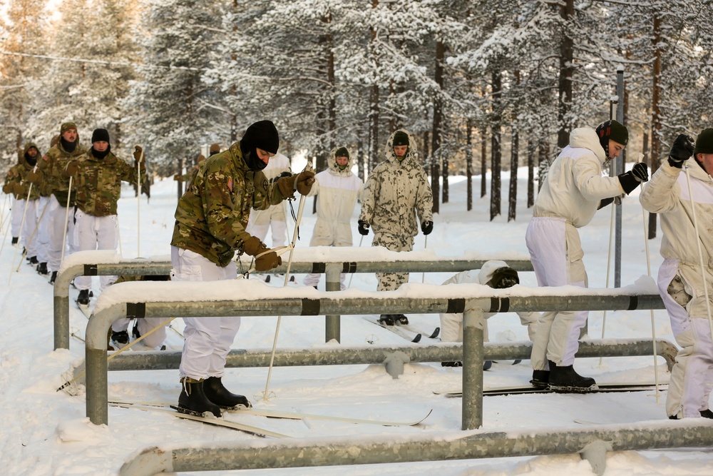 Charlie Troop, 3-71 Cavalry Regiment, 1BCT, 10th Mountain Division train with Finnish soldiers on a ski obstacle course during Defense Exercise North in Sodankyla Garrison, Finland, during Exercise Arctic Forge '23 on Feb. 21, 2023