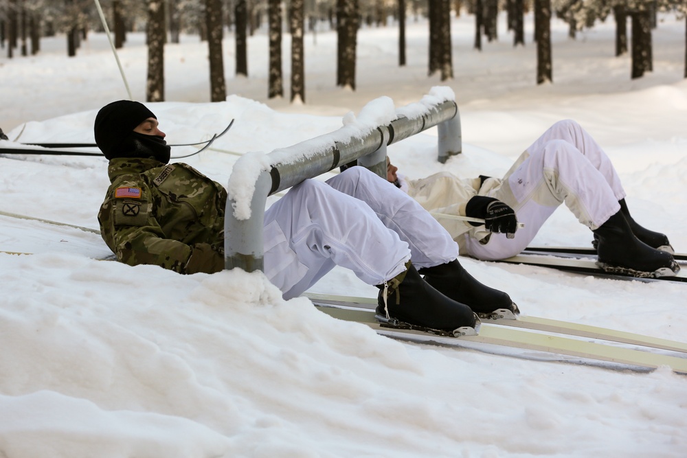 Charlie Troop, 3-71 Cavalry Regiment, 1BCT, 10th Mountain Division train with Finnish soldiers on a ski obstacle course during Defense Exercise North in Sodankyla Garrison, Finland, during Exercise Arctic Forge '23 on Feb. 21, 2023