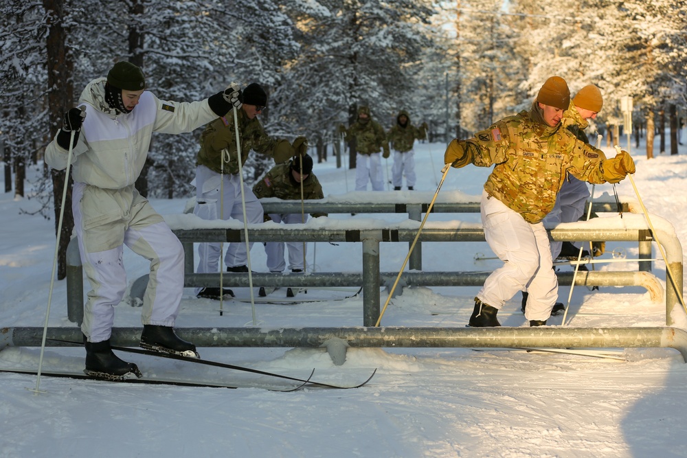 Charlie Troop, 3-71 Cavalry Regiment, 1BCT, 10th Mountain Division train with Finnish soldiers on a ski obstacle course during Defense Exercise North in Sodankyla Garrison, Finland, during Exercise Arctic Forge '23 on Feb. 21, 2023