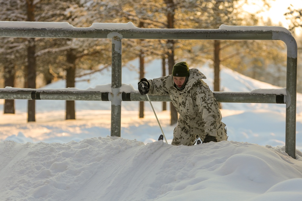 Charlie Troop, 3-71 Cavalry Regiment, 1BCT, 10th Mountain Division train with Finnish soldiers on a ski obstacle course during Defense Exercise North in Sodankyla Garrison, Finland, during Exercise Arctic Forge '23 on Feb. 21, 2023