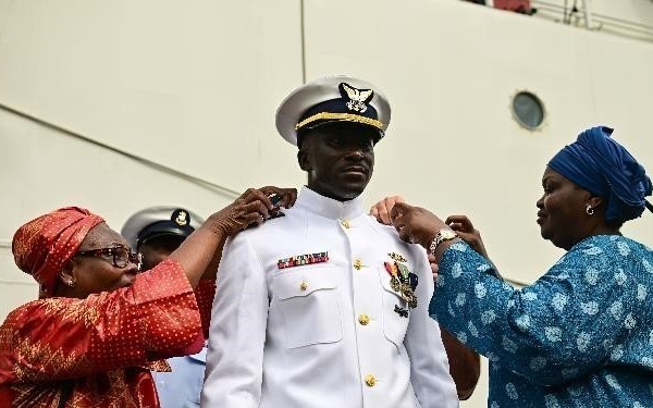 Ensign Mohammad Diakite promotes to Lt.j.g with his family in attendance in Abidjan, Côte d’Ivoire