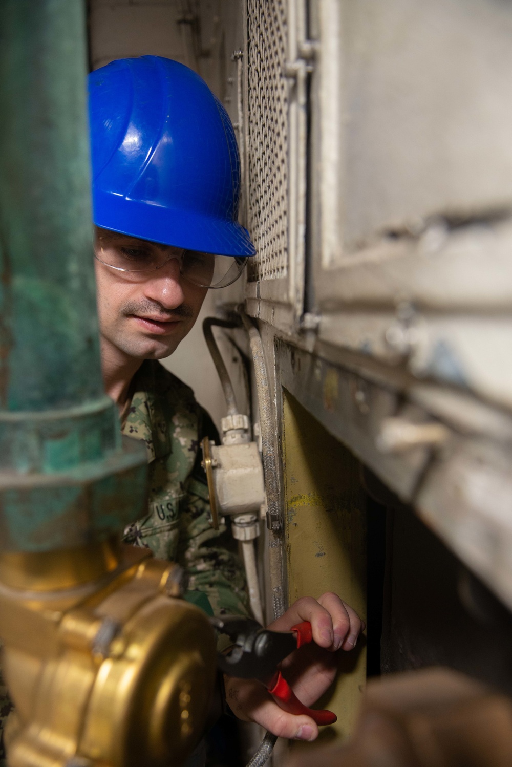 Sailor performing maintenance