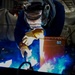 Contractor welds aboard the USS John C. Stennis