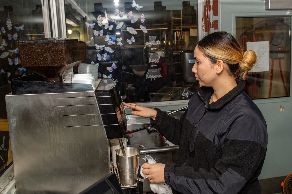 Sailor prepares coffee