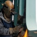 Contractor grinds aboard the USS John C. Stennis