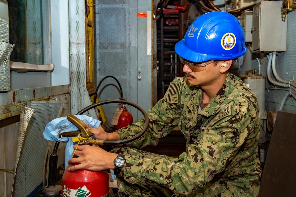 Sailor performing maintenance