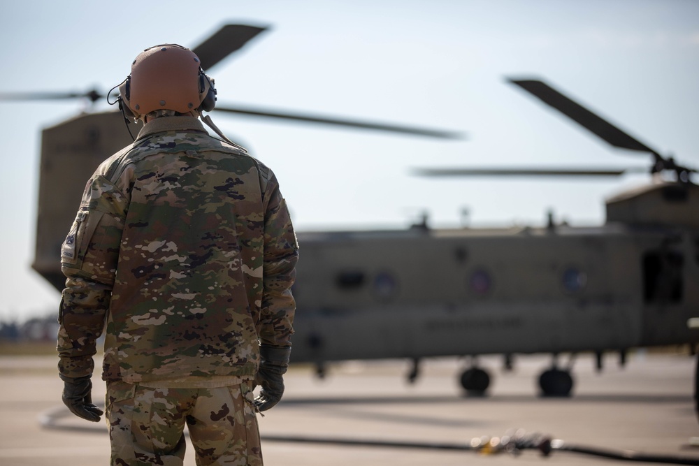 U.S. Army Soldier prepares for rapid refuelling to a CH-47 Chinook