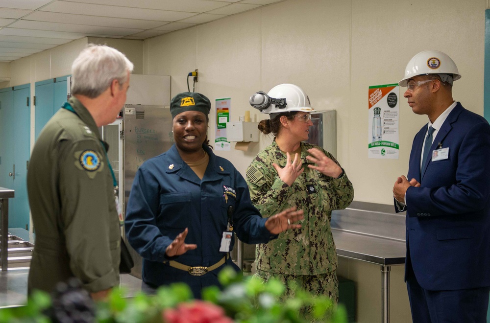 Naval Air Force Atlantic (left) and the Honorable Assist. Sec. of the Navy (Manpower and Reserve Affairs) Franklin R. Parker (right), speak with Sailors