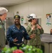 Naval Air Force Atlantic (left) and the Honorable Assist. Sec. of the Navy (Manpower and Reserve Affairs) Franklin R. Parker (right), speak with Sailors