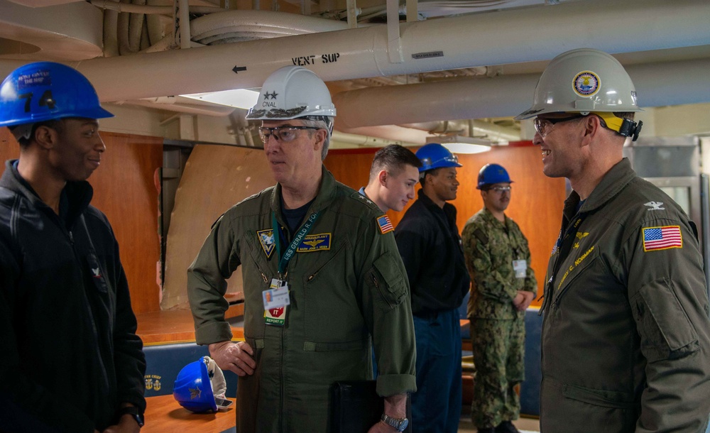 Naval Air Force Atlantic (left) and the Honorable Assist. Sec. of the Navy (Manpower and Reserve Affairs) Franklin R. Parker (right), speak with Sailors