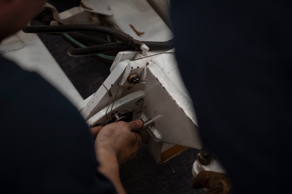 USS Carl Vinson (CVN70) Sailors prepare for deck maintenance