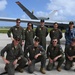 RAAF members pose for a photos with USAF MQ-9 Reaper