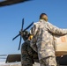 A US Army UH-60 Blackhawk is loaded with humanitarian aid supplies
