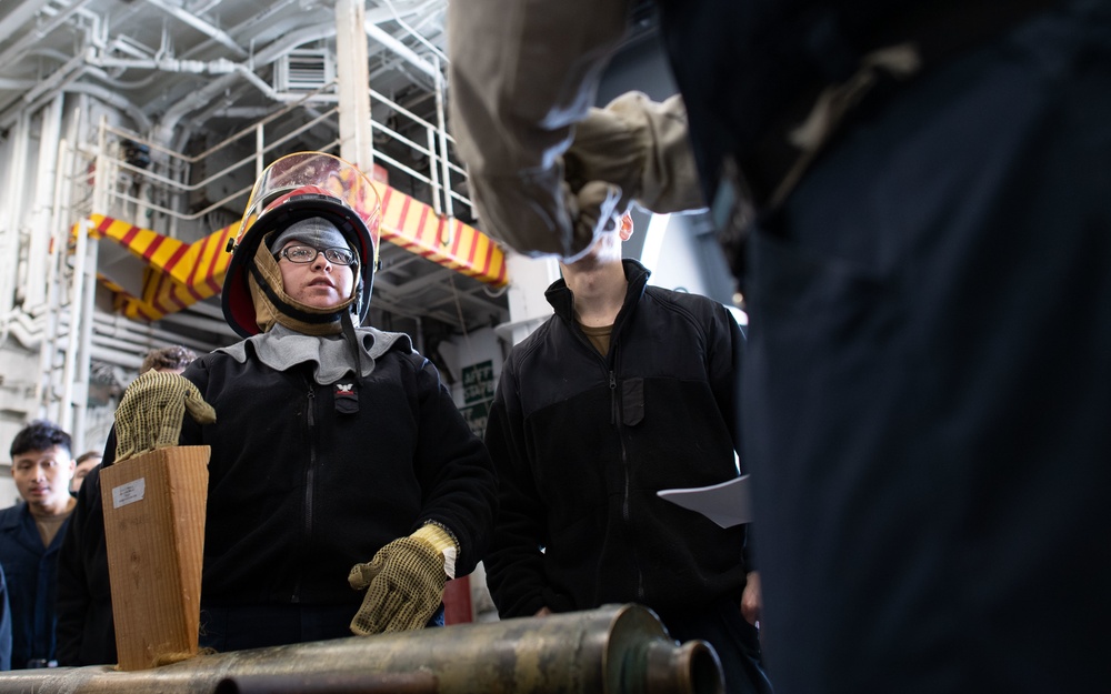 USS Carl Vinson (CVN-70) Sailor Participates In Pipe Patching