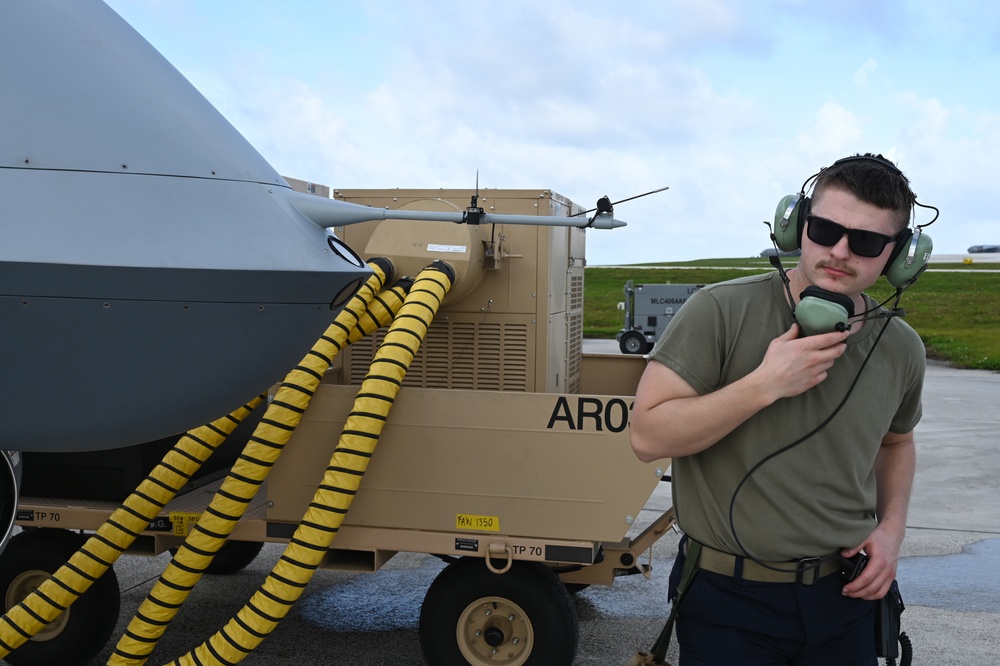 U.S. Air Force 119th Wing aircraft crew chief monitors a MQ-9 Reaper