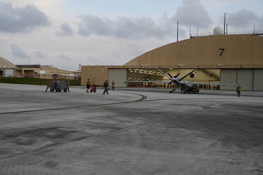 U.S. Air Force maintainers tow a MQ-9 Reaper