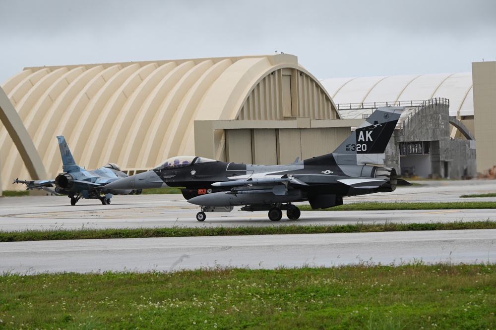 F-16 Aggressors taxi on the flightline