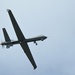 MQ-9 Reaper flys over the airfield