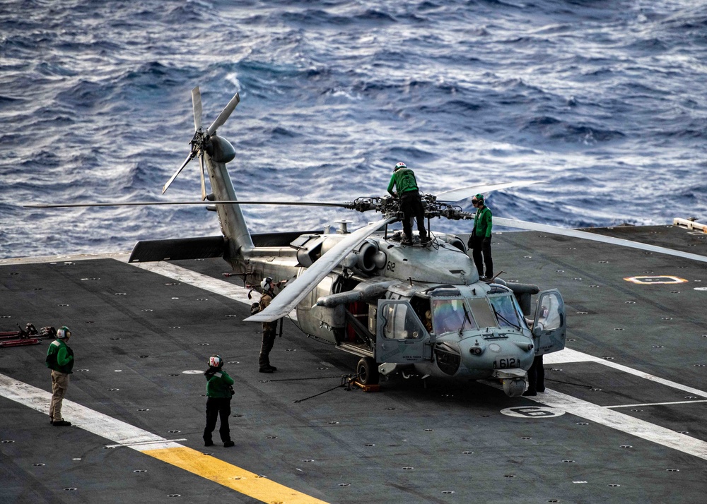 Sailors Perform Maintenance On Aircraft