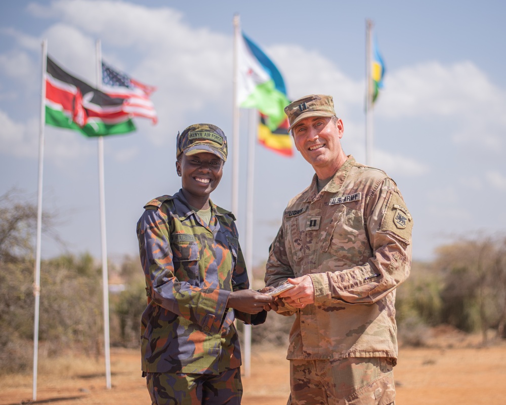 U.S. Army Capt. Joe Legros and Kenyan Defence Forces Capt. Jackie Wachira exchange gifts at JA23