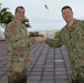 Maj. Jeffrey Hainsworth receives DCO coin from Navy Capt. Ian Fowler