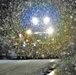 Snow removal operations after dark at Fort McCoy