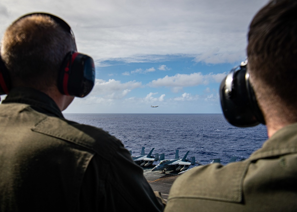 A P-8 Poseidon Flies By The Nimitz