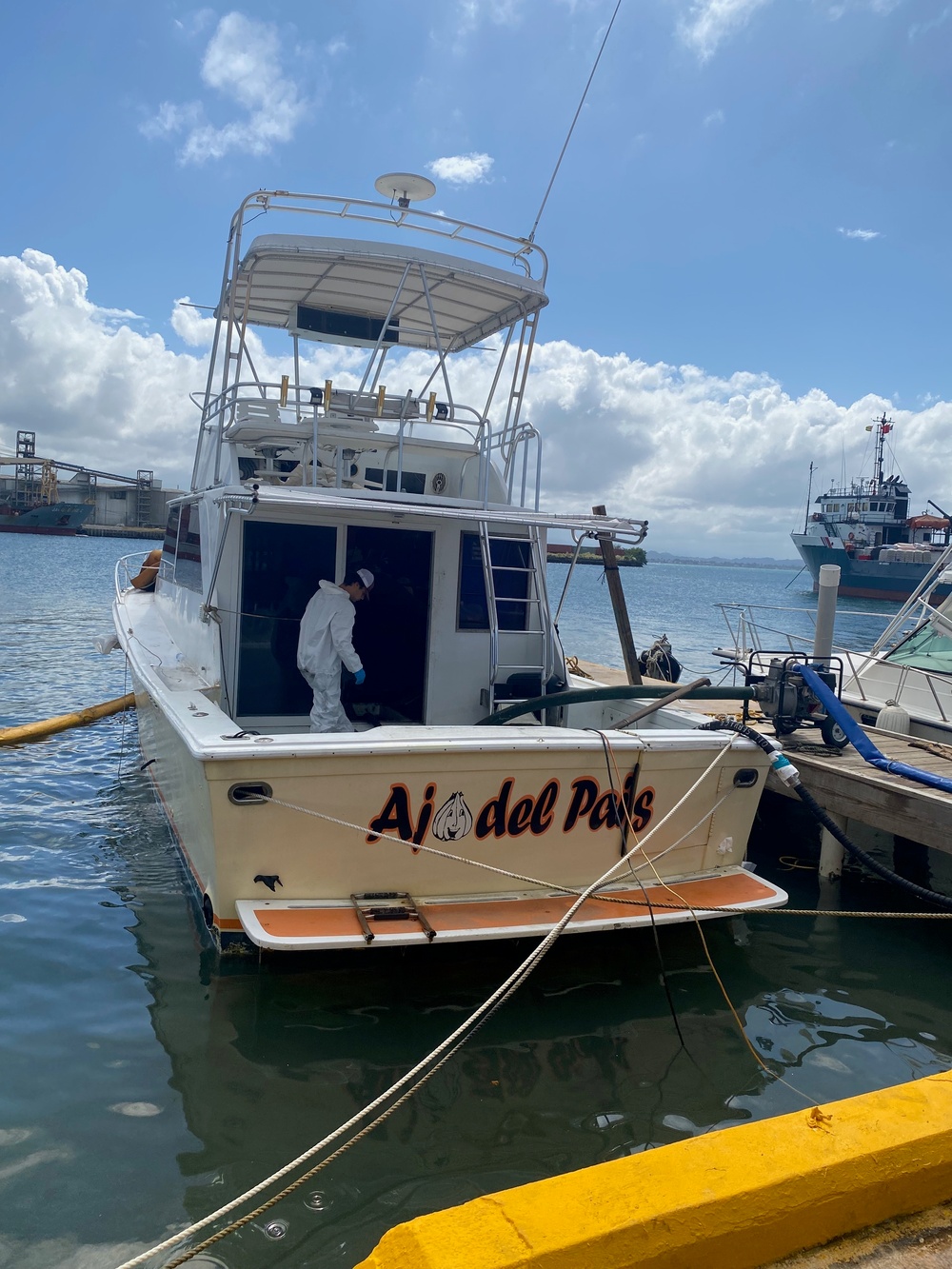 Coast Guard, clean-up crews remove pollution threat from partially sunken vessel in San Juan Harbor, Puerto Rico