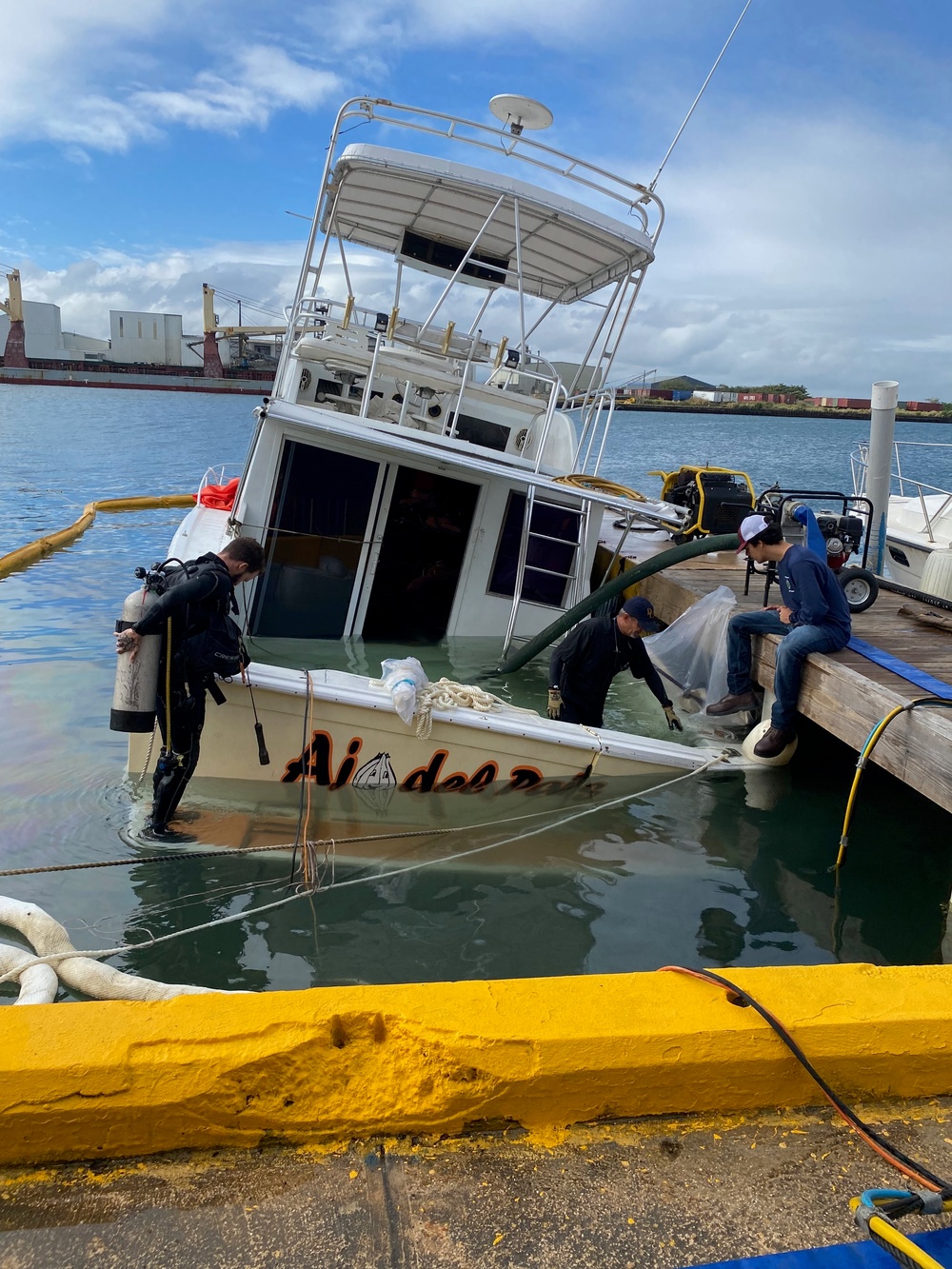 Coast Guard, clean-up crews remove pollution threat from partially sunken vessel in San Juan Harbor, Puerto Rico