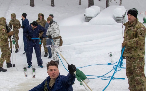 3-71 Cavalry Regiment, 1BCT, 10th Mountain Division train on what to do if a soldier breaks through ice while crossing a river during Defense Exercise North in Sodankyla Garrison, Finland, during Exercise Arctic Forge '23 on Feb. 23, 2023