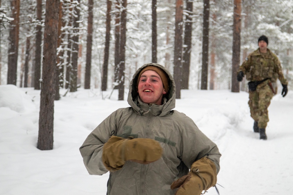 3-71 Cavalry Regiment, 1BCT, 10th Mountain Division train on what to do if a soldier breaks through ice while crossing a river during Defense Exercise North in Sodankyla Garrison, Finland, during Exercise Arctic Forge '23 on Feb. 23, 2023