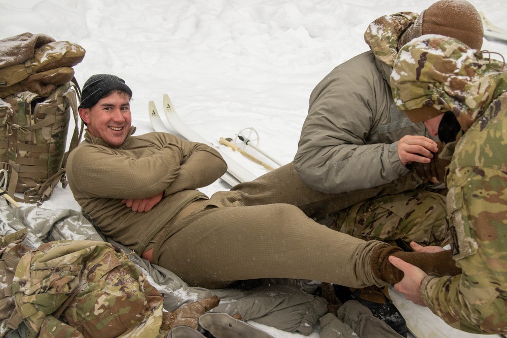 3-71 Cavalry Regiment, 1BCT, 10th Mountain Division train on what to do if a soldier breaks through ice while crossing a river during Defense Exercise North in Sodankyla Garrison, Finland, during Exercise Arctic Forge '23 on Feb. 23, 2023