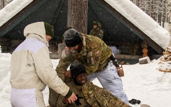 3-71 Cavalry Regiment, 1BCT, 10th Mountain Division train on what to do if a soldier breaks through ice while crossing a river during Defense Exercise North in Sodankyla Garrison, Finland, during Exercise Arctic Forge '23 on Feb. 23, 2023