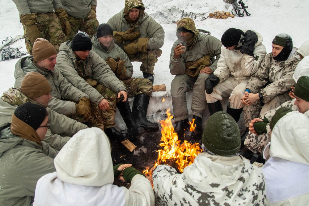 3-71 Cavalry Regiment, 1BCT, 10th Mountain Division train on what to do if a soldier breaks through ice while crossing a river during Defense Exercise North in Sodankyla Garrison, Finland, during Exercise Arctic Forge '23 on Feb. 23, 2023