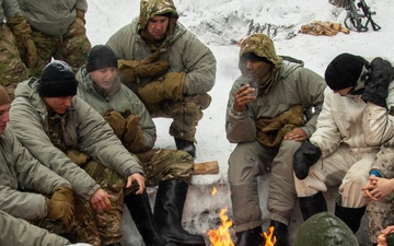 3-71 Cavalry Regiment, 1BCT, 10th Mountain Division train on what to do if a soldier breaks through ice while crossing a river during Defense Exercise North in Sodankyla Garrison, Finland, during Exercise Arctic Forge '23 on Feb. 23, 2023