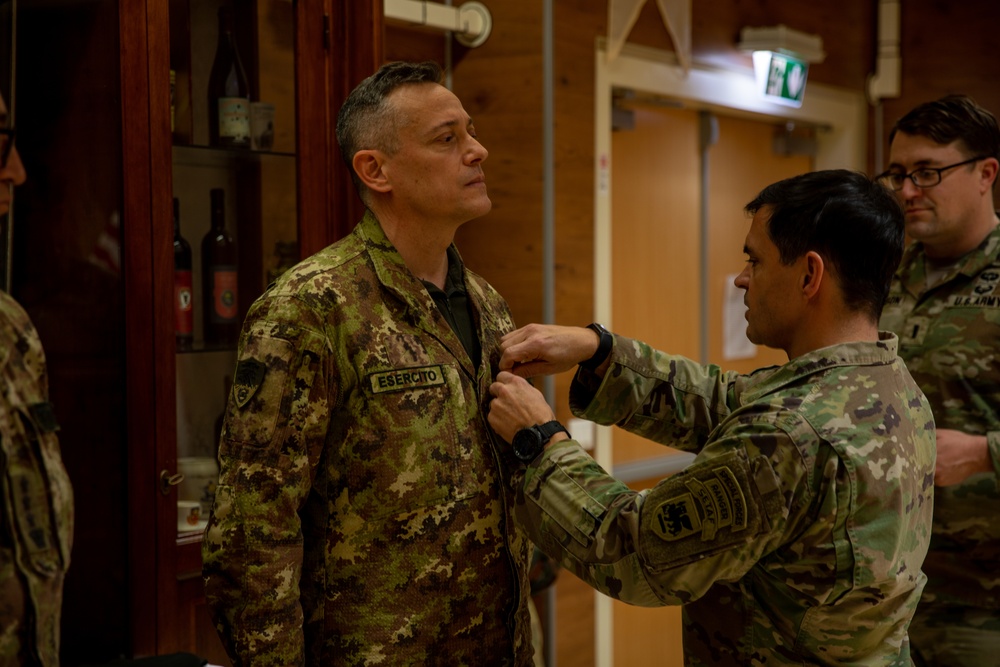 Italian Armed Forces training liaison officer Sgt. Maj. Raffaello Mastromarino recieves the Meritorious Service Medal