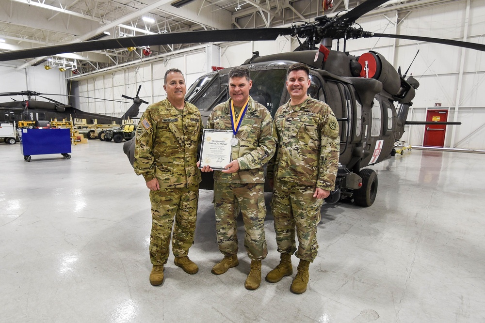 Chief Warrant Officer 5 Matthew Fitter receives the Order of Saint Michael