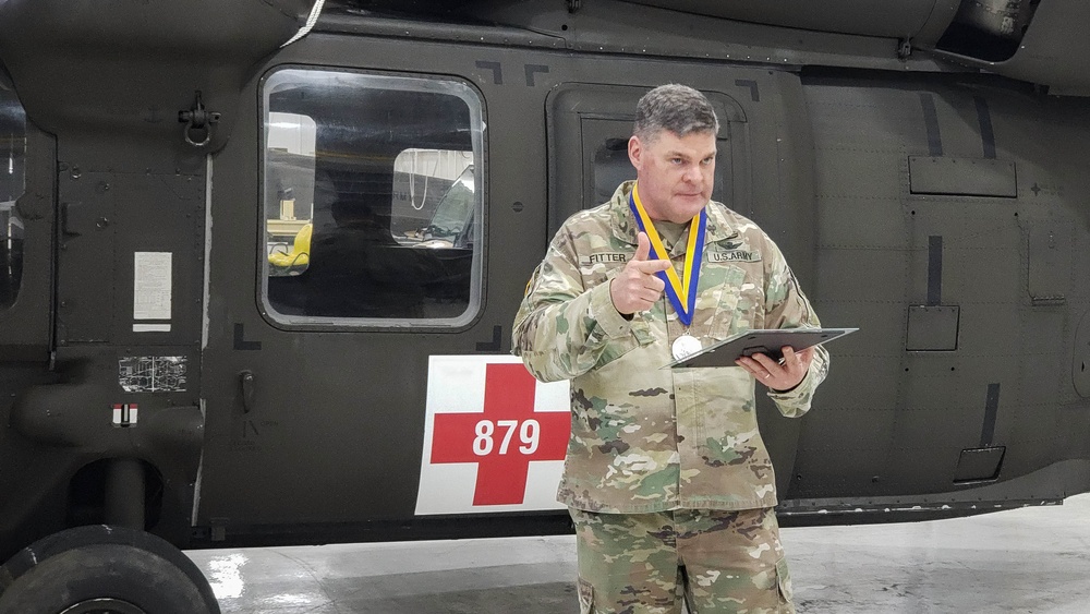 Chief Warrant Officer 5 Matthew Fitter receives the Order of Saint Michael