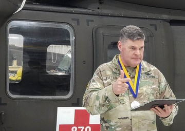 Chief Warrant Officer 5 Matthew Fitter receives the Order of Saint Michael