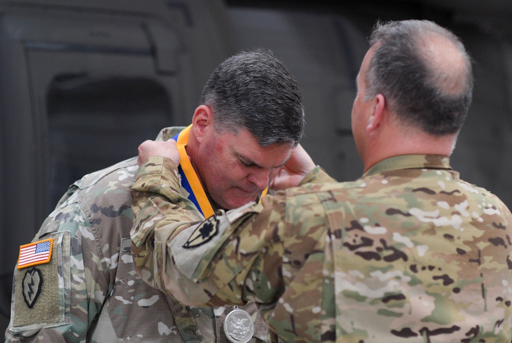 Chief Warrant Officer 5 Matthew Fitter receives the Order of Saint Michael