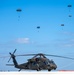 Joint special operations forces preform free falls over Blackhawk unit