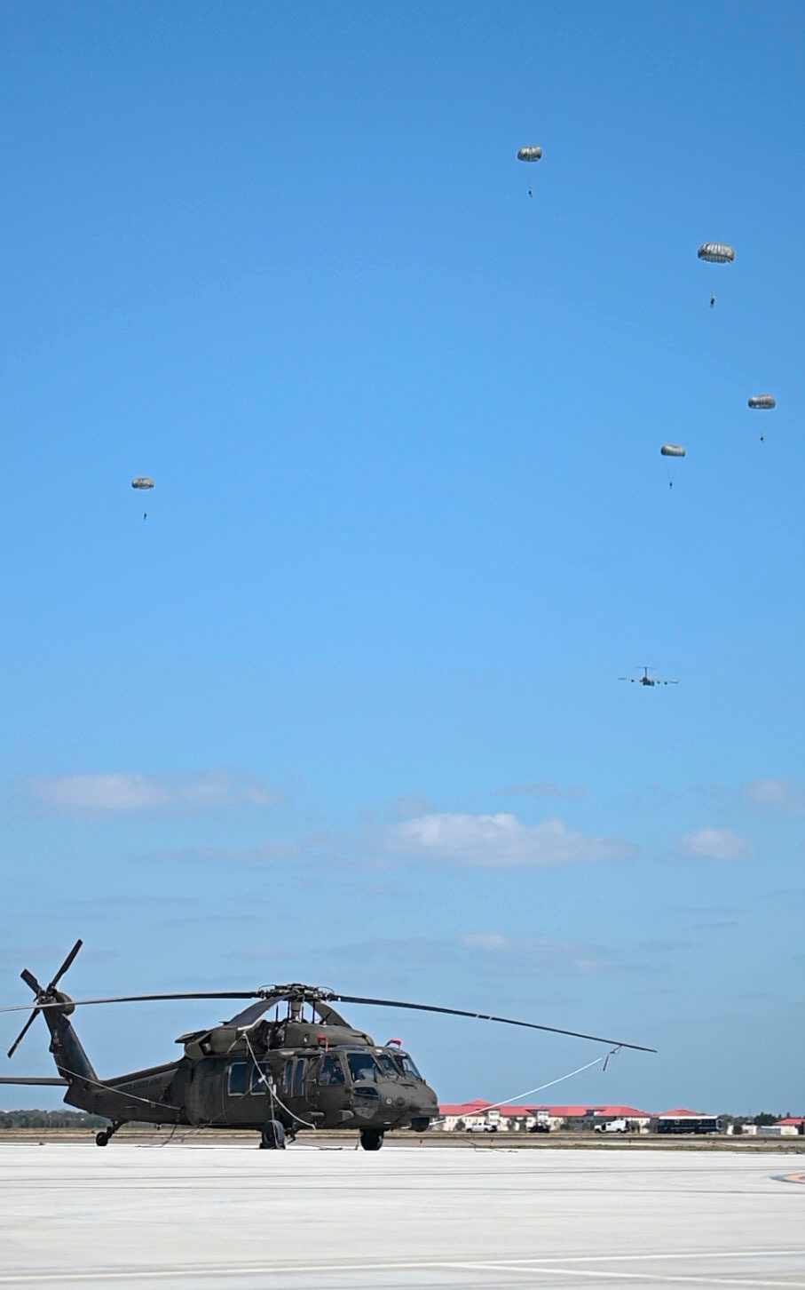 Joint special operations forces preform free falls over Blackhawk unit