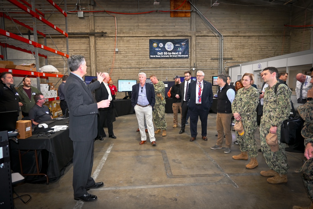 Timothy Ruth, NIWC - Pacific, speaks to visitors from the DON IT - West and AFCEA conference about the use of RFID tags for material tracking during their tour of the U.S. Navy‘s first 5G smart warehouse on NAS North Island, Feb. 15.