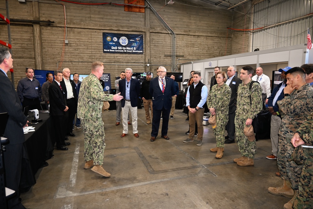 Capt. Cory Schemm, commanding officer, NAVSUP Fleet Logistics Center San Diego, speaks to visitors from the DON IT – West and AFCEA conference on a tour of the U.S. Navy‘s first 5G smart warehouse on NAS - North Island, Feb.15.