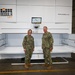 Vice Adm. Kelly Aeschbach, Commander, NIF, stands beside Capt. Cory Schemm, commanding officer, NAVSP Fleet Logistics Center San Diego, showcasing one of the new Modula Vertical Lift Modules at the 5G smart warehouse on NAS - North Island, Feb.15.