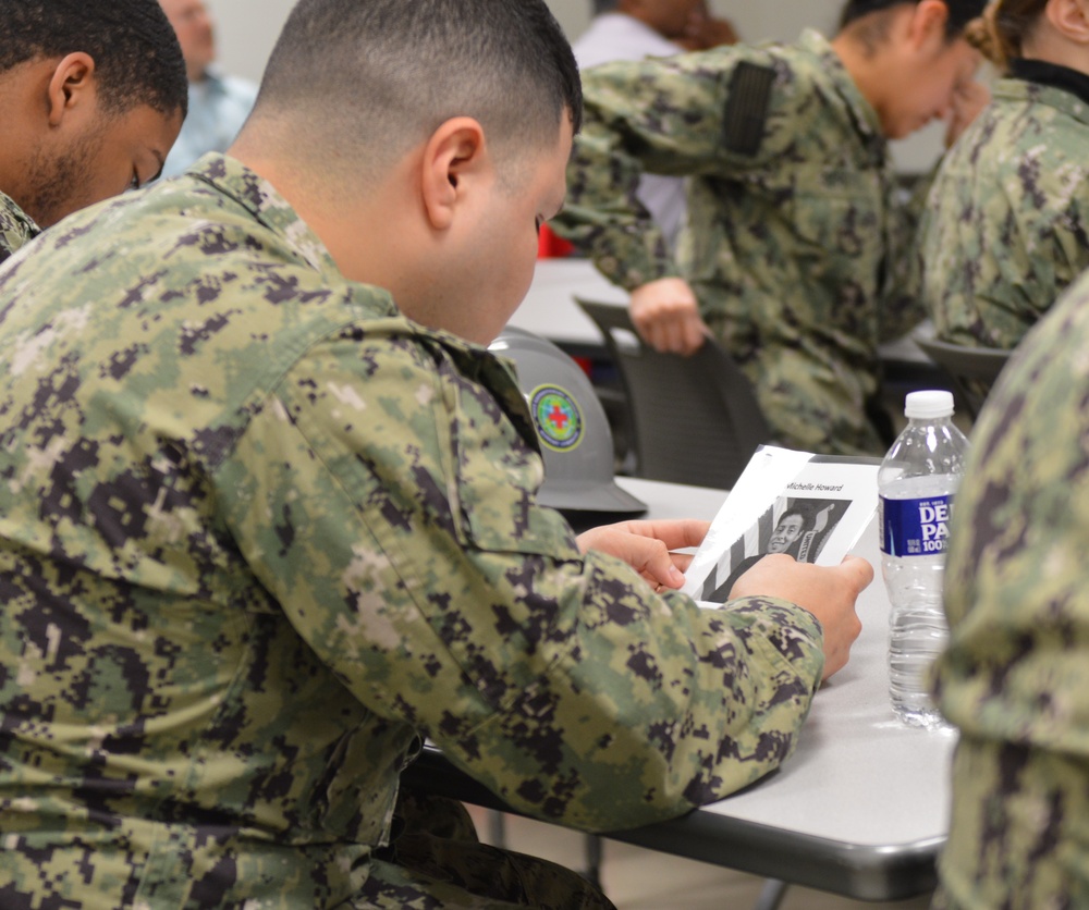 Naval Medical Readiness Logistics Command Sailors and Civilians receive a history presentation from Hampton Roads Naval Museum as part of African American History Month