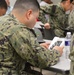 Naval Medical Readiness Logistics Command Sailors and Civilians receive a history presentation from Hampton Roads Naval Museum as part of African American History Month