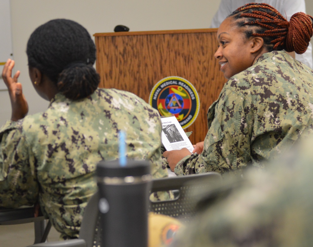 Naval Medical Readiness Logistics Command Sailors and Civilians receive a history presentation from Hampton Roads Naval Museum as part of African American History Month