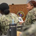 Naval Medical Readiness Logistics Command Sailors and Civilians receive a history presentation from Hampton Roads Naval Museum as part of African American History Month